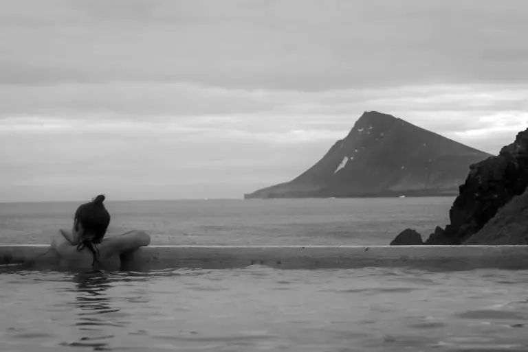 A woman at the Krossnes Swimming Pool looking at the scenery