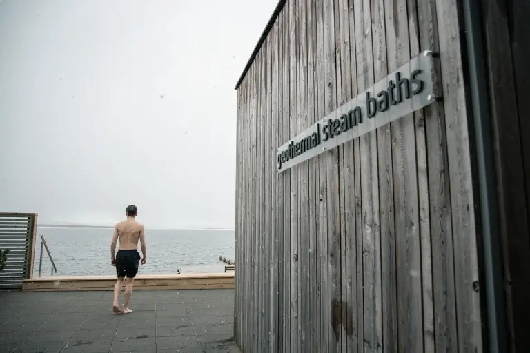 A man next to the Geothermal Steam Baths at the Laugarvatn Fontana