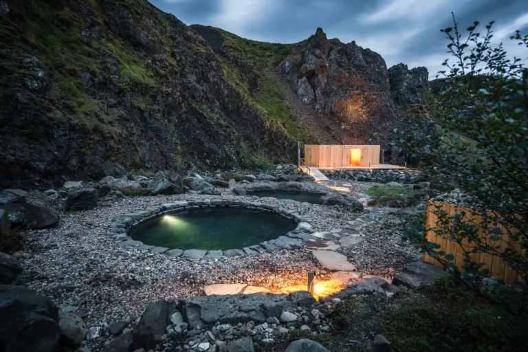 Husafell Canyon Baths in the evening, with the lights on