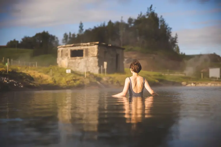 A woman in the Secret Lagoon pool