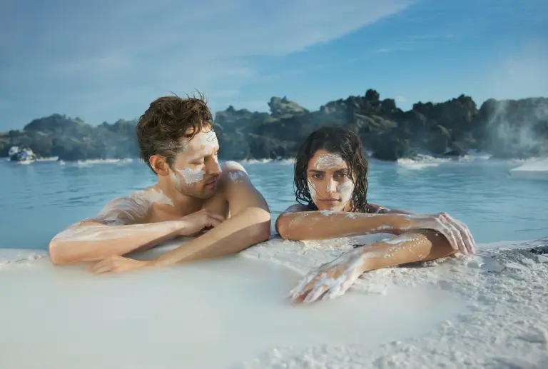 A couple at the Blue Lagoon with silica mud on their faces