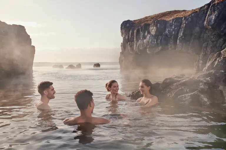 Group of people enjoying the Sky Lagoon pool