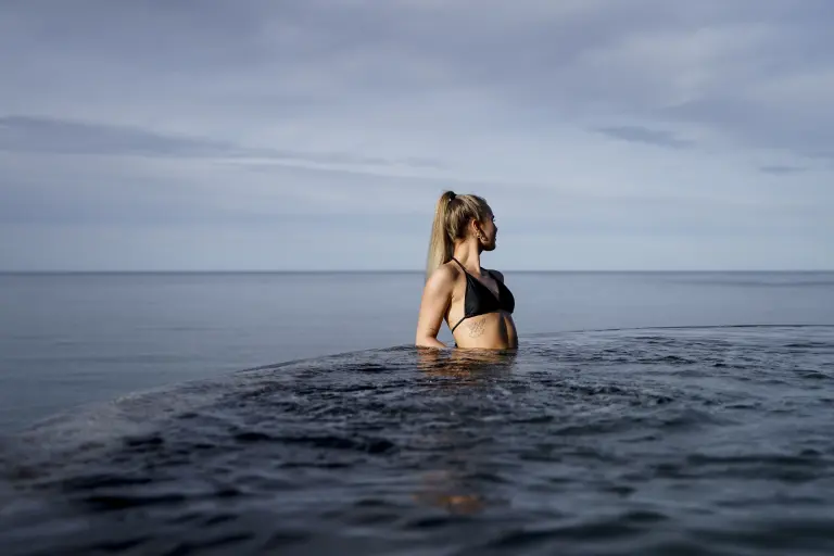 A woman in the infinity pool at the GeoSea